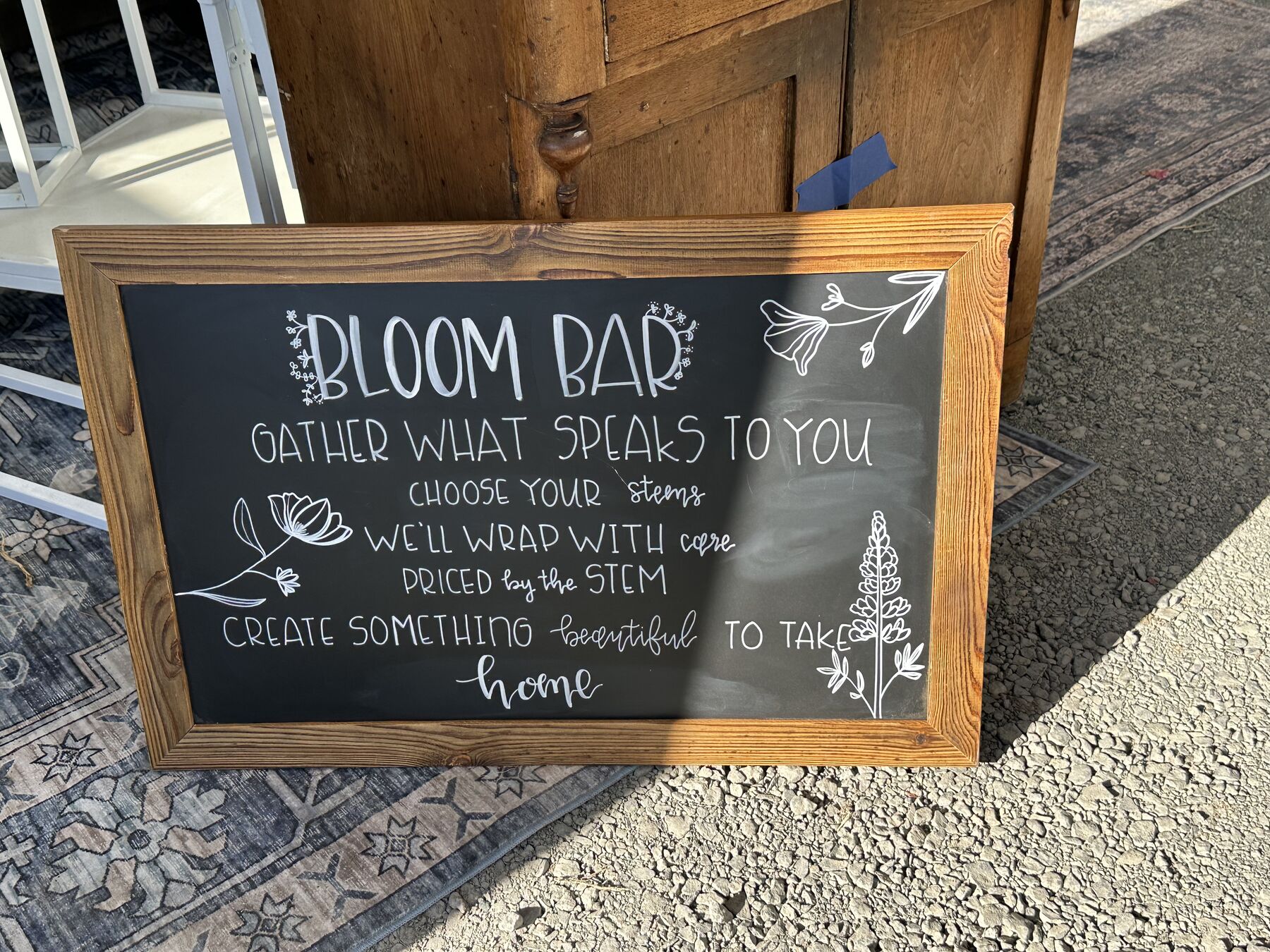 Chalkboard sign reading Bloom Bar