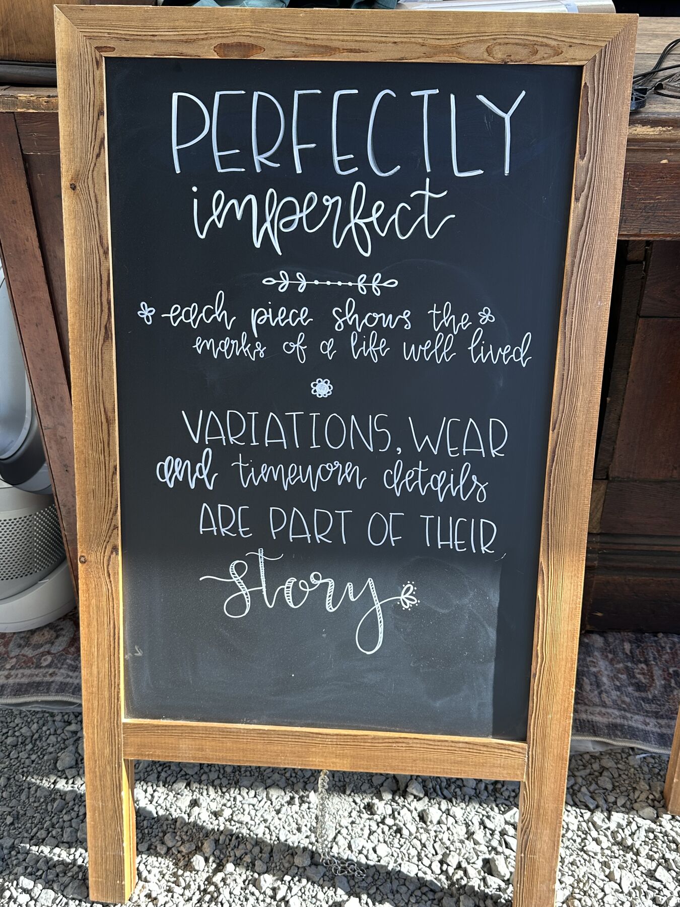 A chalkboard reading Perfectly Imperfect